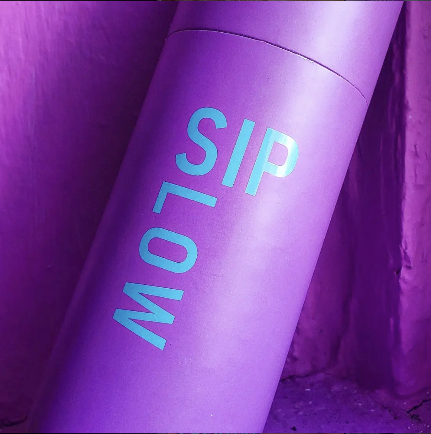 Purple Tshikovi Tea House canister with turquoise Sip Slow lettering